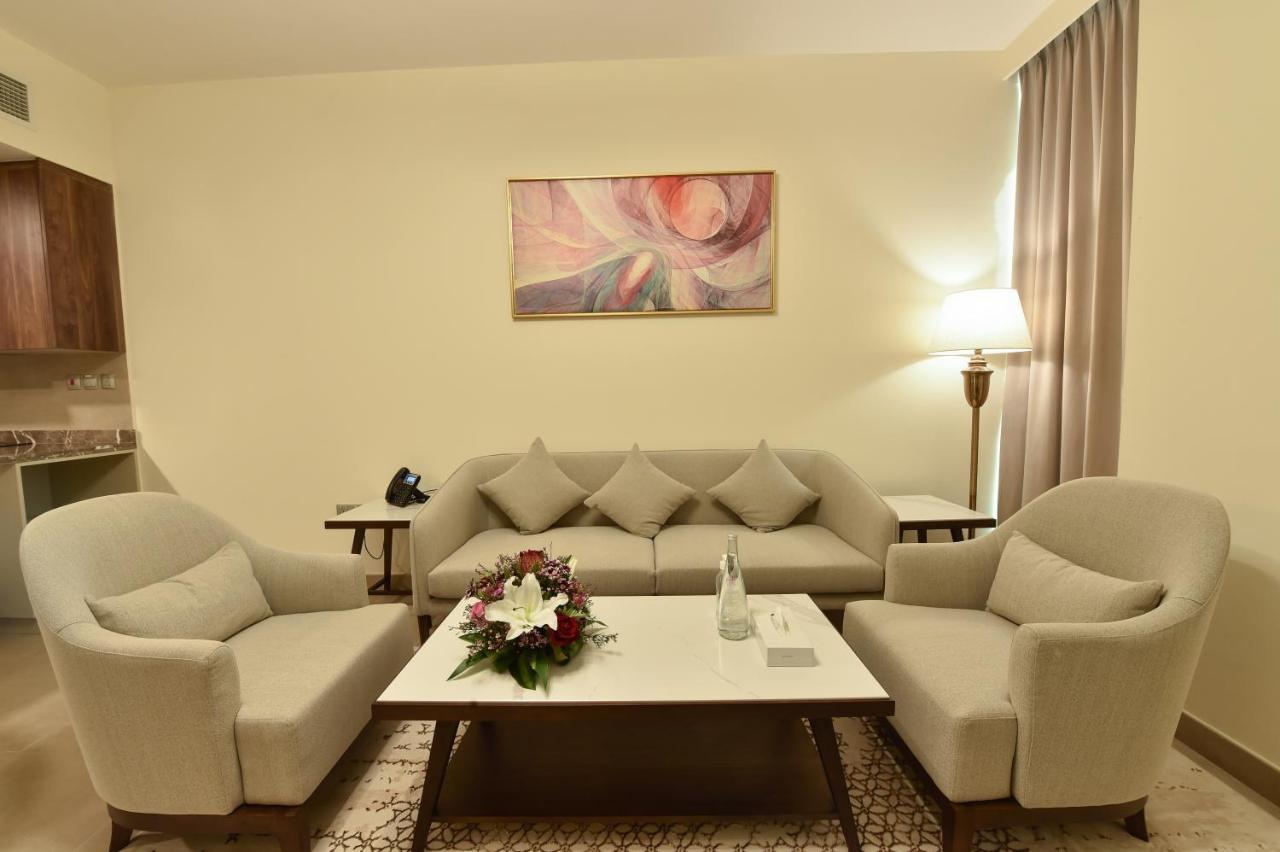 Saray Deluxe Hotel Apartments Abu Dhabi Exterior photo A living room in a hotel suite