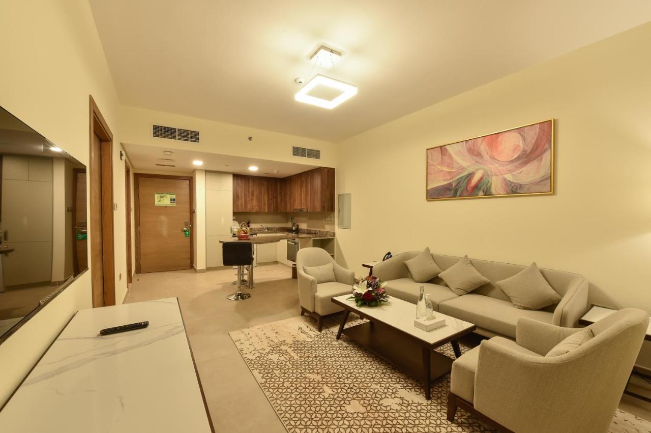 Saray Deluxe Hotel Apartments Abu Dhabi Exterior photo A living room in a typical apartment