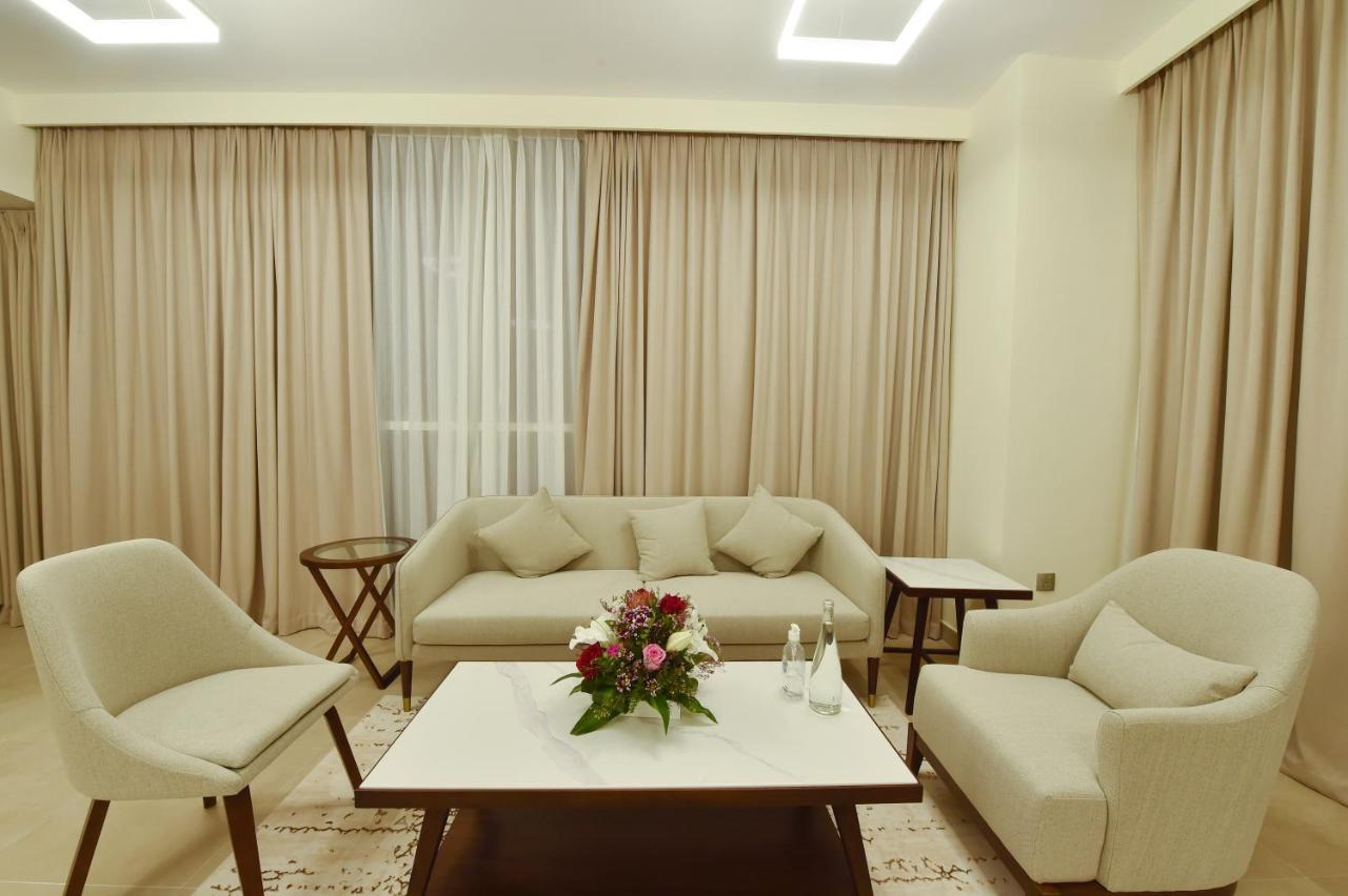 Saray Deluxe Hotel Apartments Abu Dhabi Exterior photo A living room