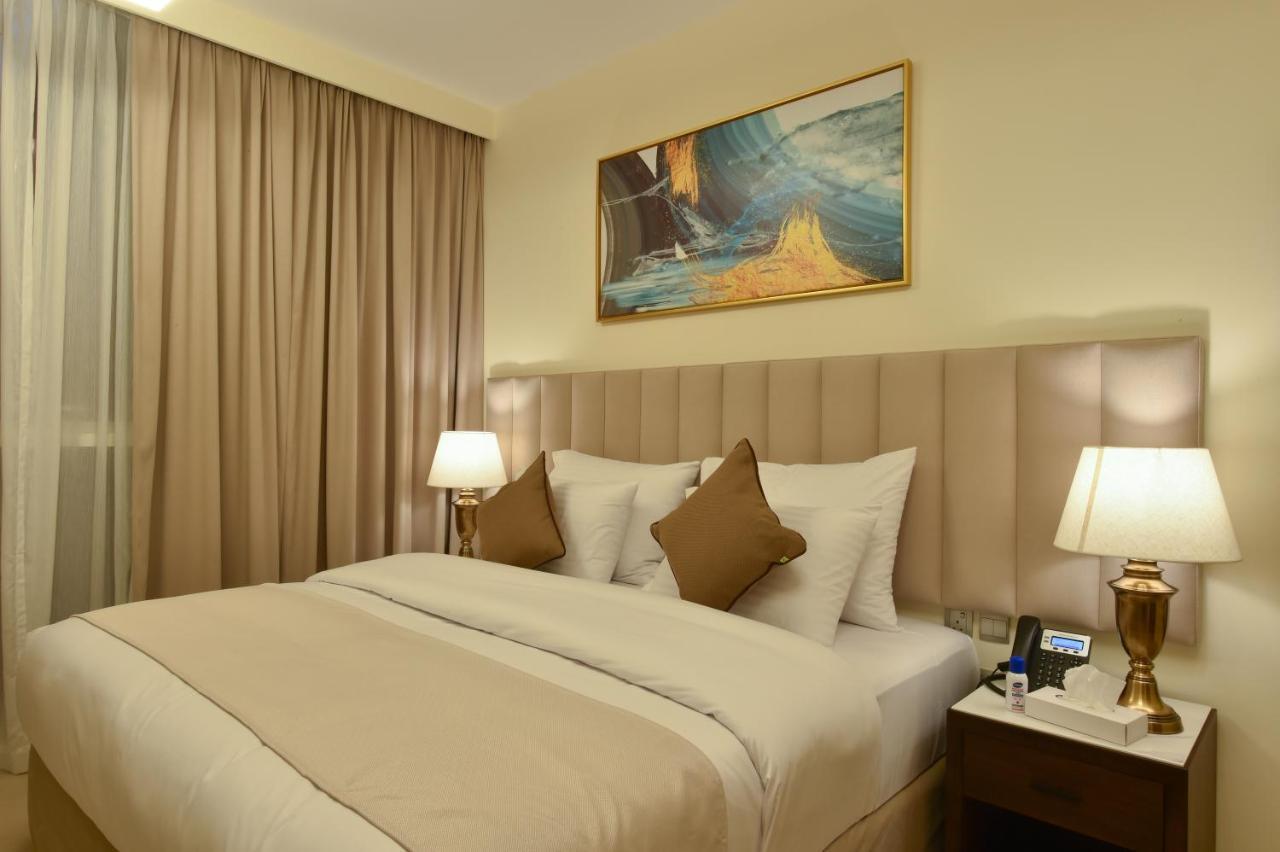 Saray Deluxe Hotel Apartments Abu Dhabi Exterior photo A bedroom at the hotel