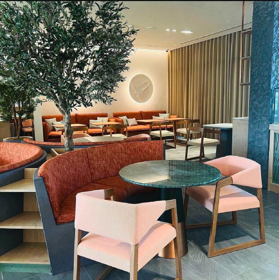 Saray Deluxe Hotel Apartments Abu Dhabi Exterior photo The lounge at London Heathrow Airport