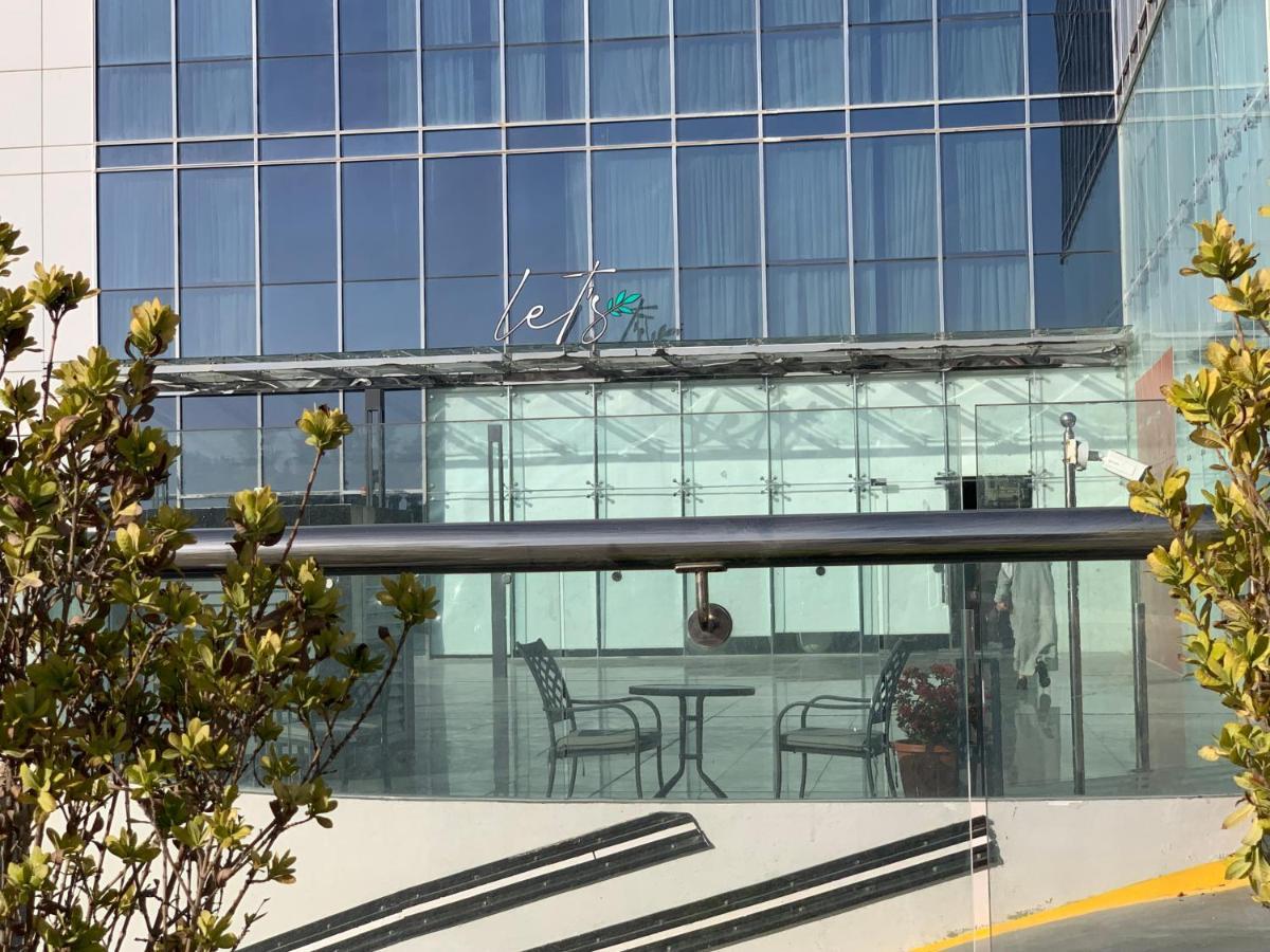 Saray Deluxe Hotel Apartments Abu Dhabi Exterior photo The entrance to the station