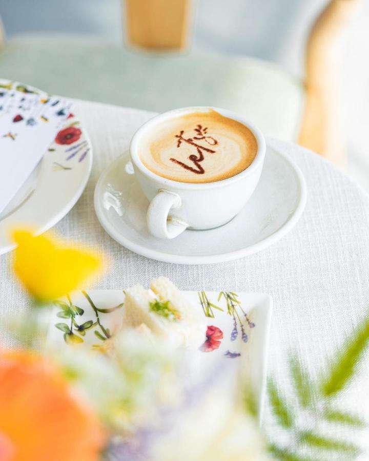 Saray Deluxe Hotel Apartments Abu Dhabi Exterior photo A cup of coffee with latte art