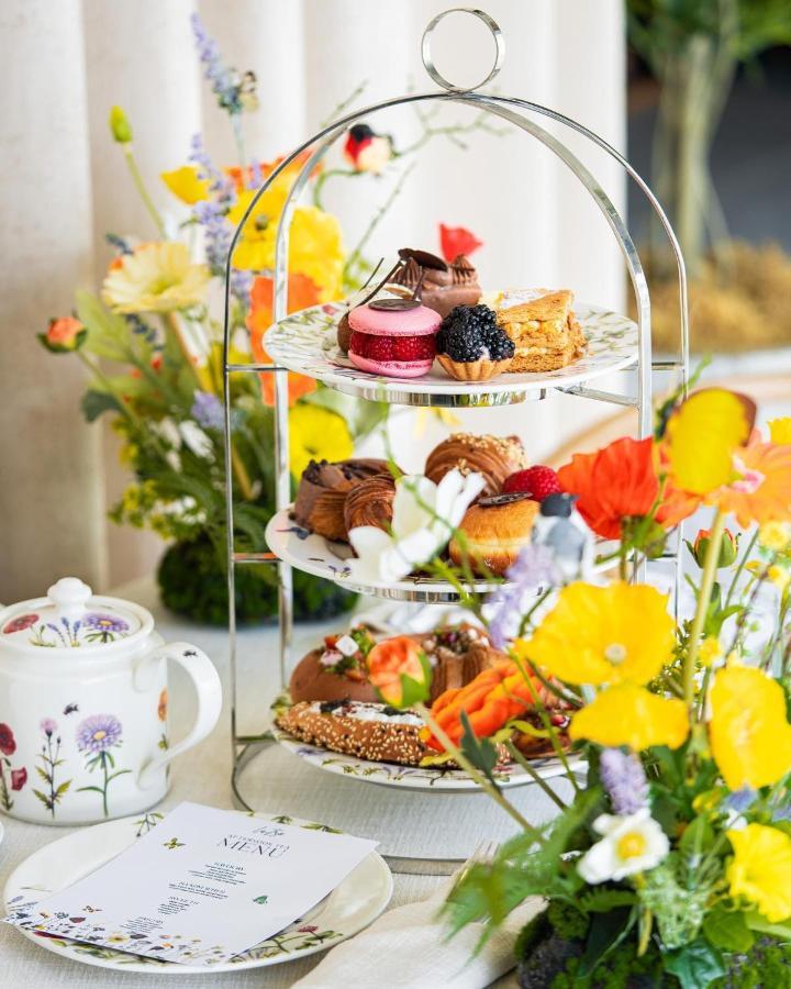 Saray Deluxe Hotel Apartments Abu Dhabi Exterior photo Afternoon tea at the Royal Botanic Gardens, Edinburgh
