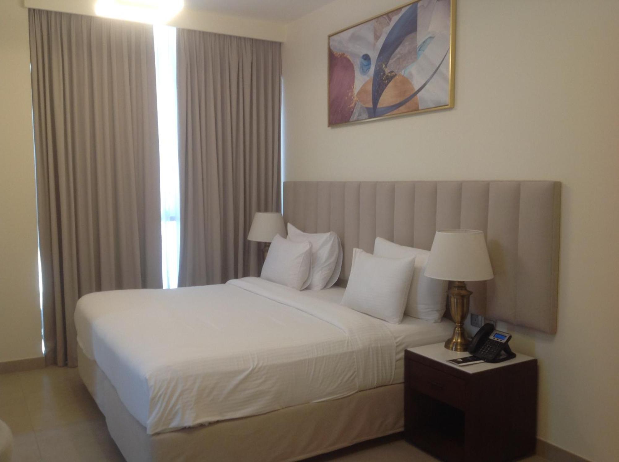 Saray Deluxe Hotel Apartments Abu Dhabi Exterior photo A bedroom at the hotel