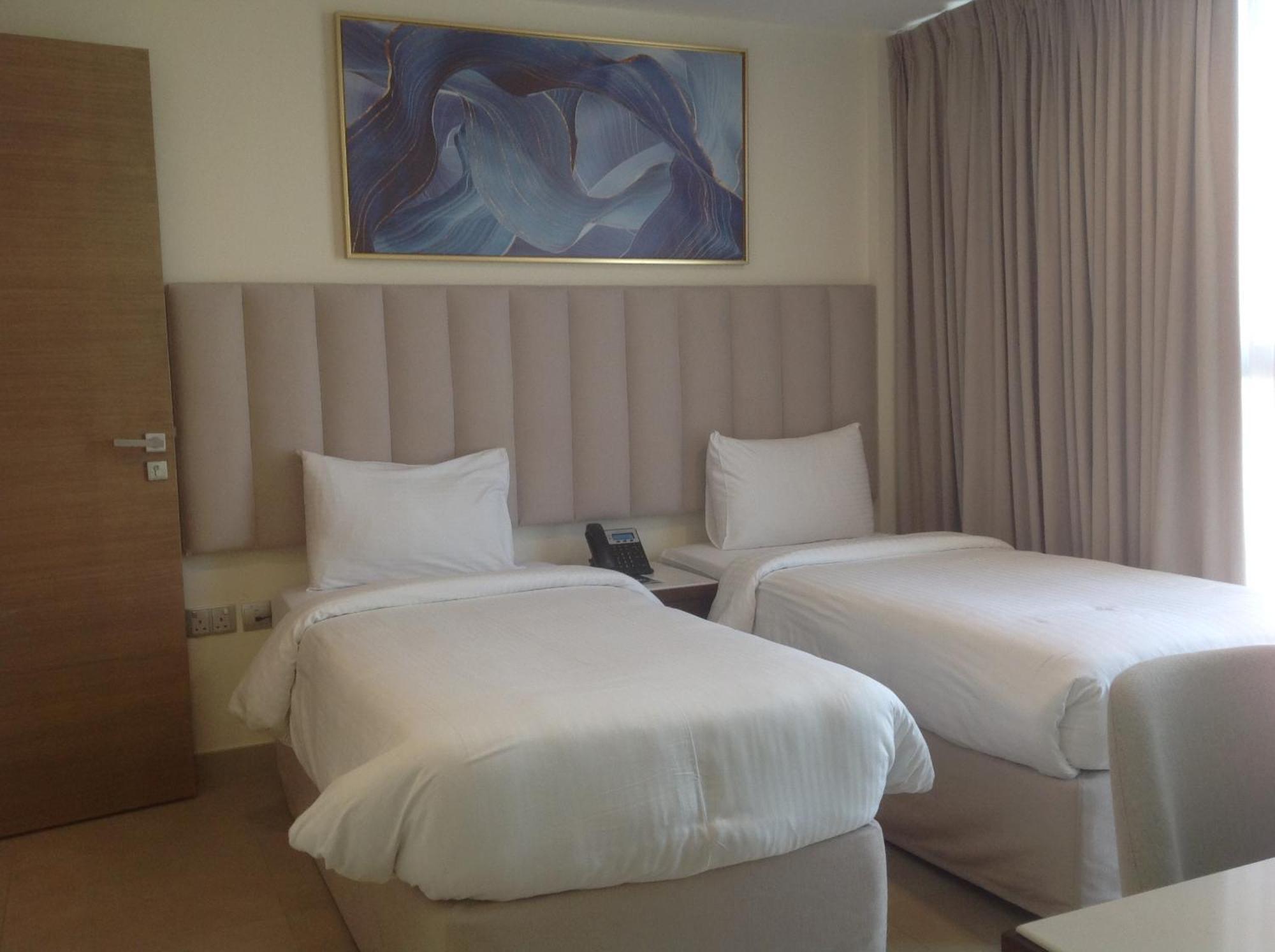 Saray Deluxe Hotel Apartments Abu Dhabi Exterior photo A room at the hotel